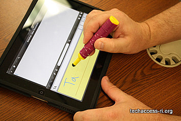 Photo of person writing in an iPad app with completed stylus